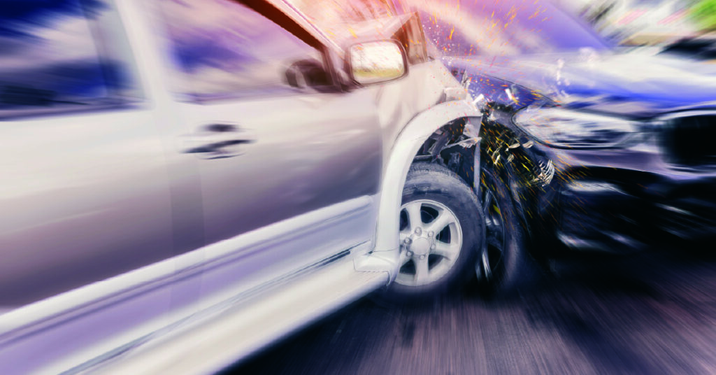 Two cars colliding in a road accident, with visible damage, sparks, and motion blur highlighting the impact